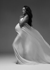 Fine art maternity photography with sheer fabric in South Florida