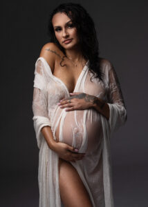 Maternity photo in sheer robe and soft light